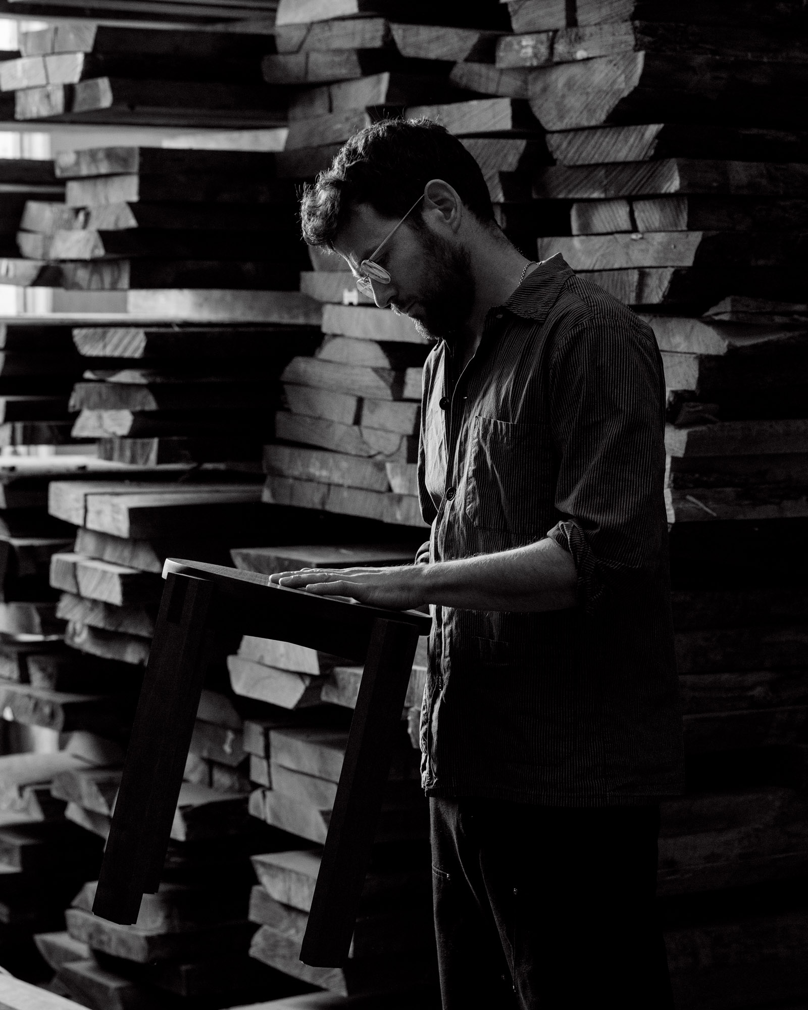 Black and white portrait of artist Christoph Mack who is Mack Furniture by photographer Raul 