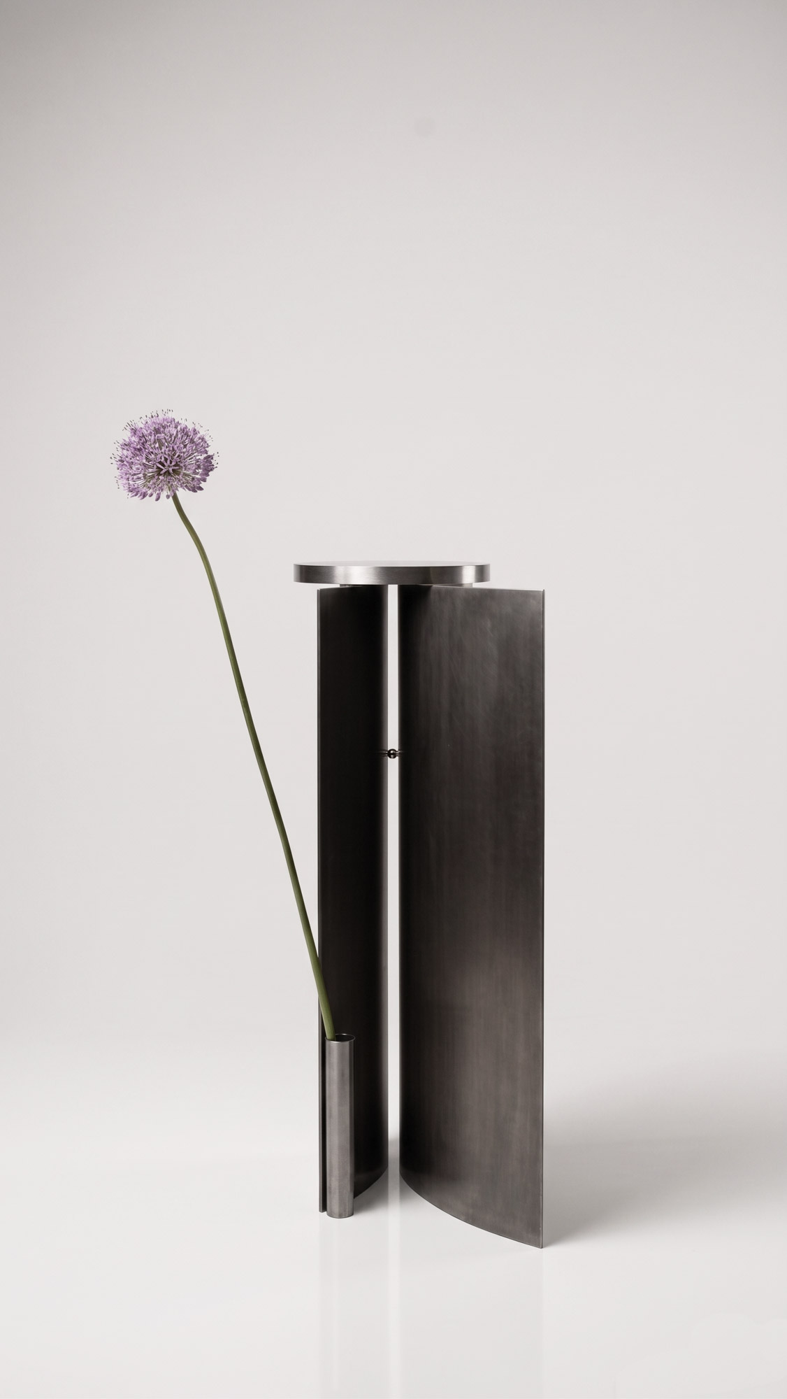 Asymptote Side Table by Anoe Melliou, stainless steel and magnets, 2025 