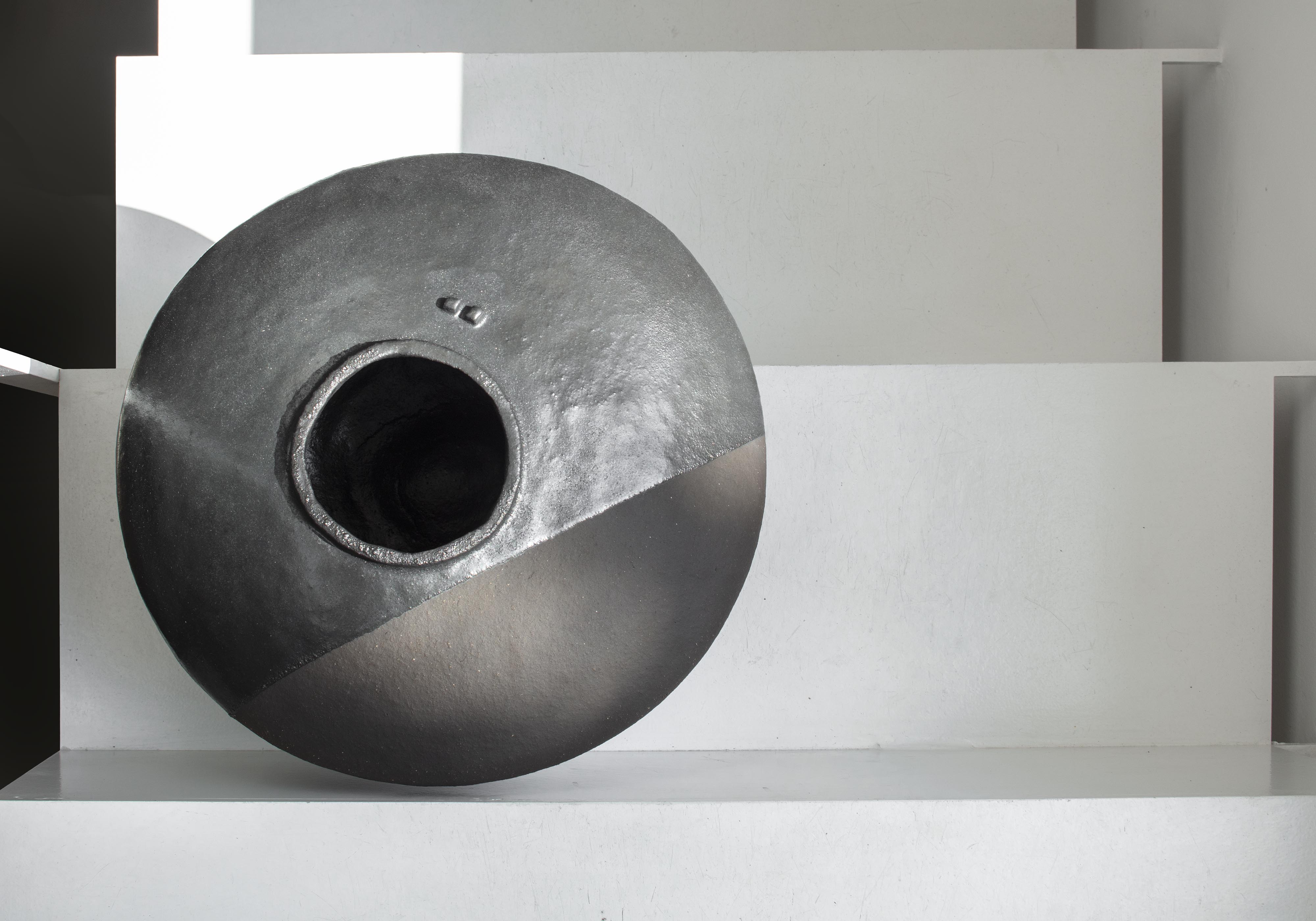 Boris Zbikowski, No 25 13, 2025, tall black ceramic vessel from Half of the Truth series