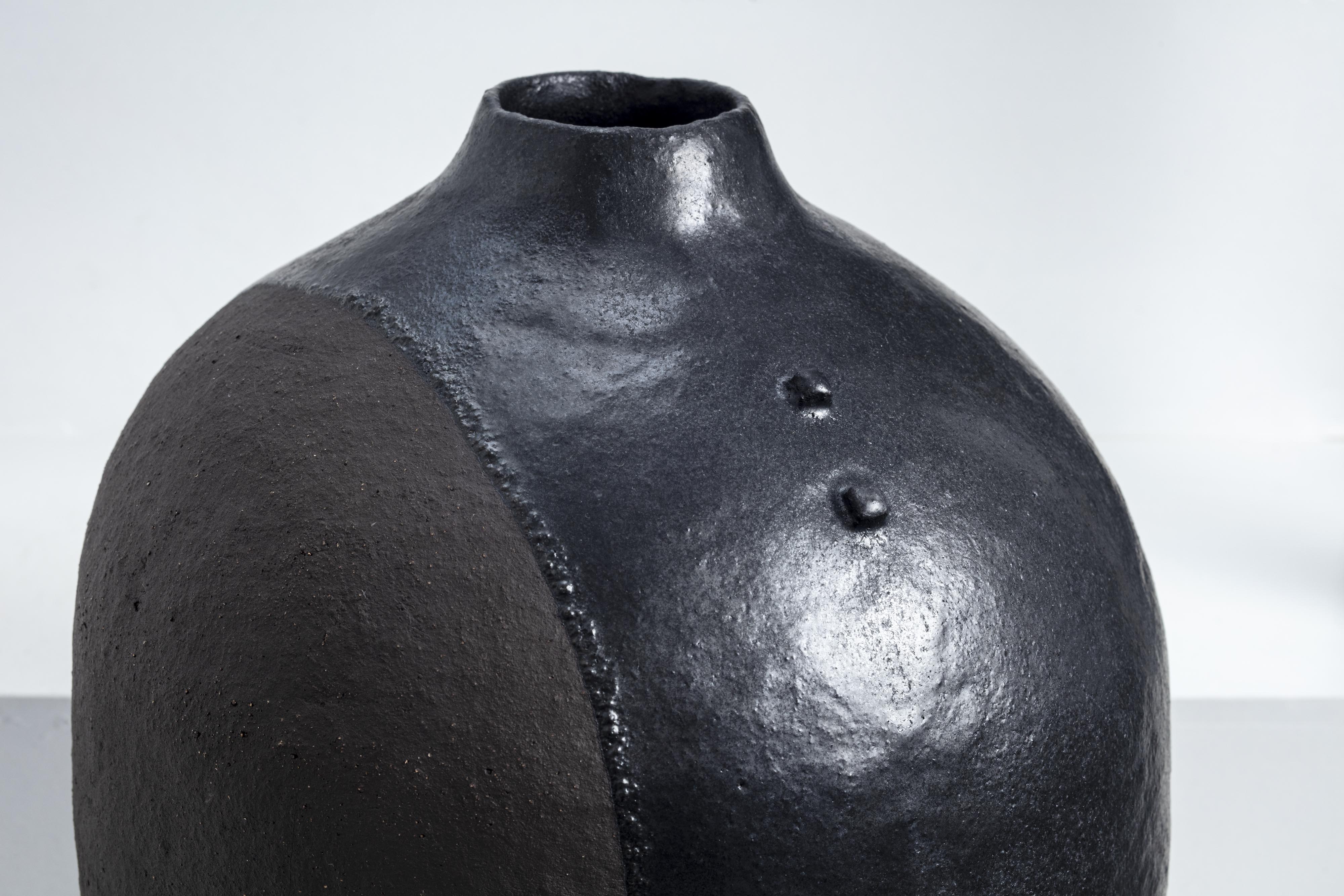 Boris Zbikowski, No 25 14, 2025, tall black ceramic vessel from Half of the Truth series