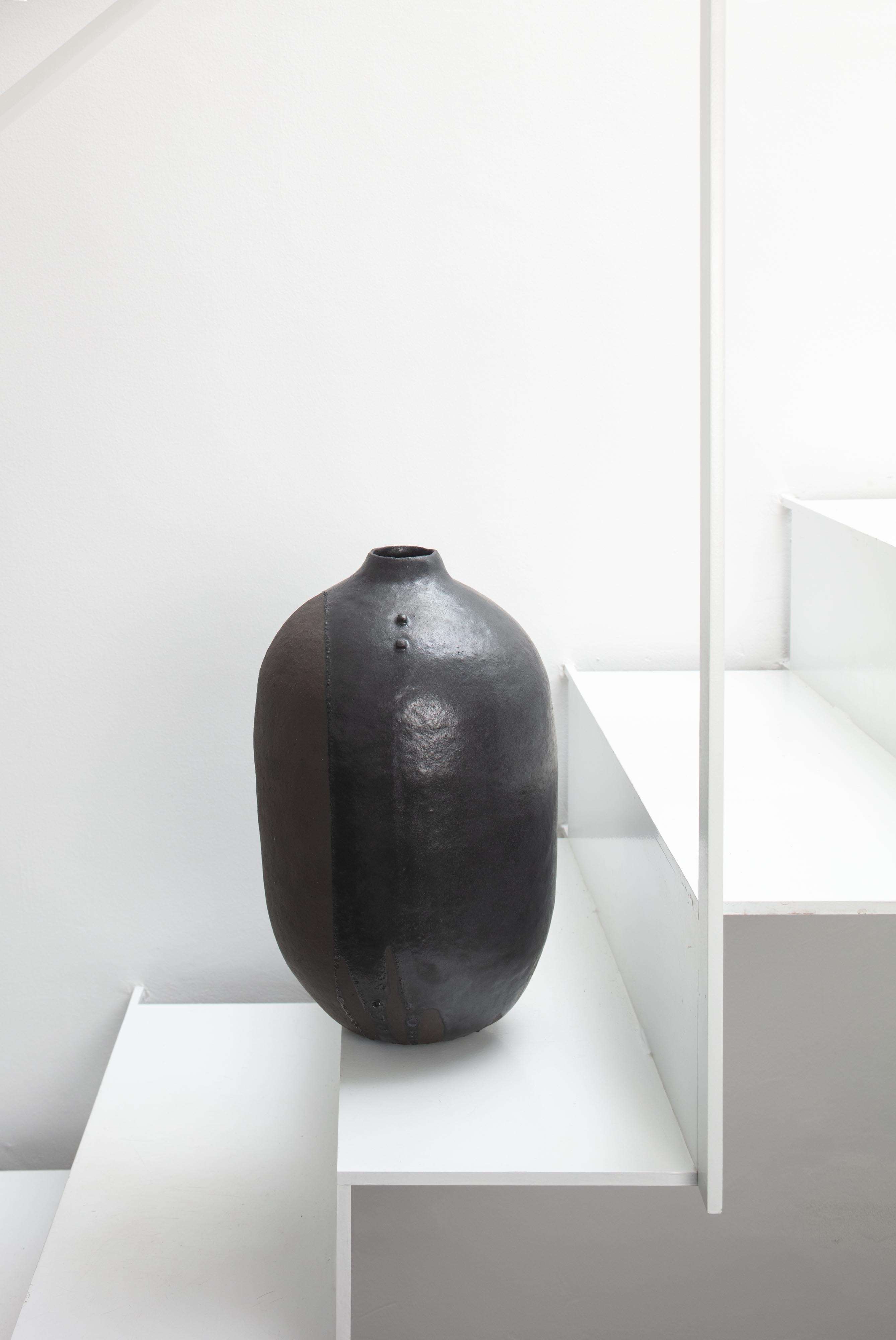 Boris Zbikowski, No 25 14, 2025, tall black ceramic vessel from Half of the Truth series 