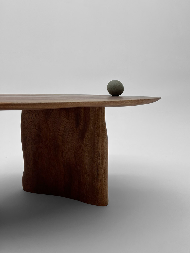 Detail of Deformed Coffee Table by Camille Tan showing surface of solid Sapele wood 