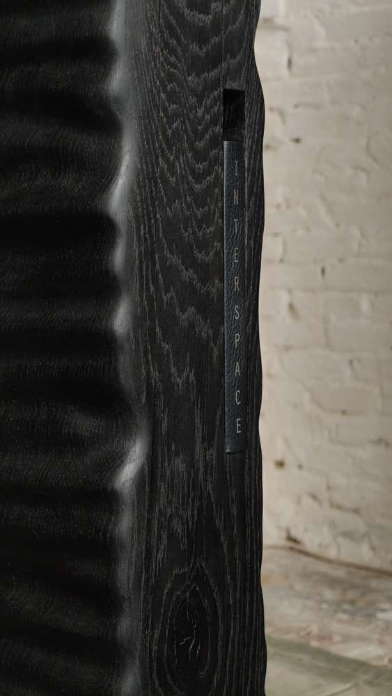 Detail of Monolith Library II by Camille Tan showing ebonised oak surface 